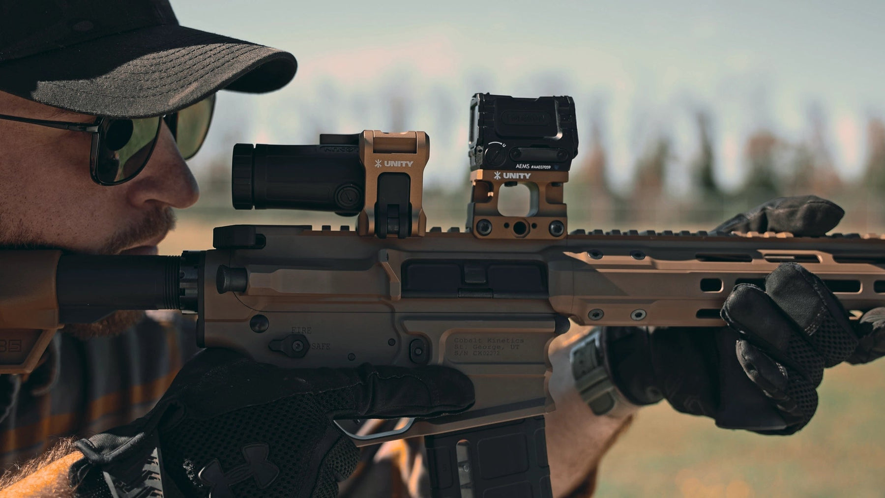 soldier aiming through an optic mounted to unity tactical ftc omni