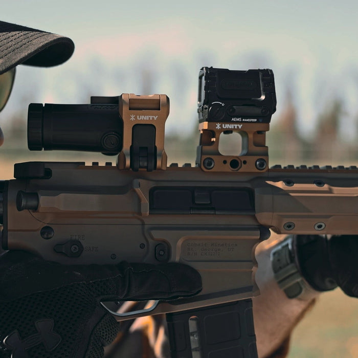 soldier aiming through an optic mounted to unity tactical ftc omni