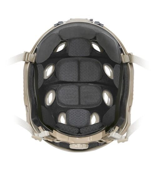 A direct, top-down view into the interior of a tan tactical helmet, showing a complete set of black ops core helmet pads arranged to provide stability and cushioning for the wearer.