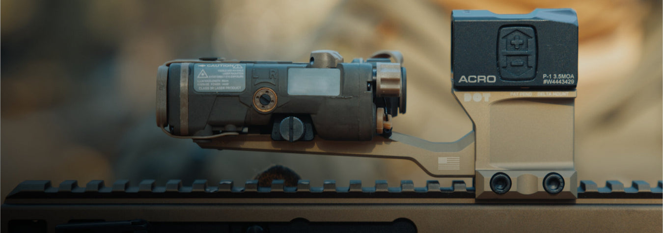 a flat dark earth delta acro riser holding an aimpoint acro p 1 optic featuring a forward cantilever mount diving board attachment that supports a laser range finder