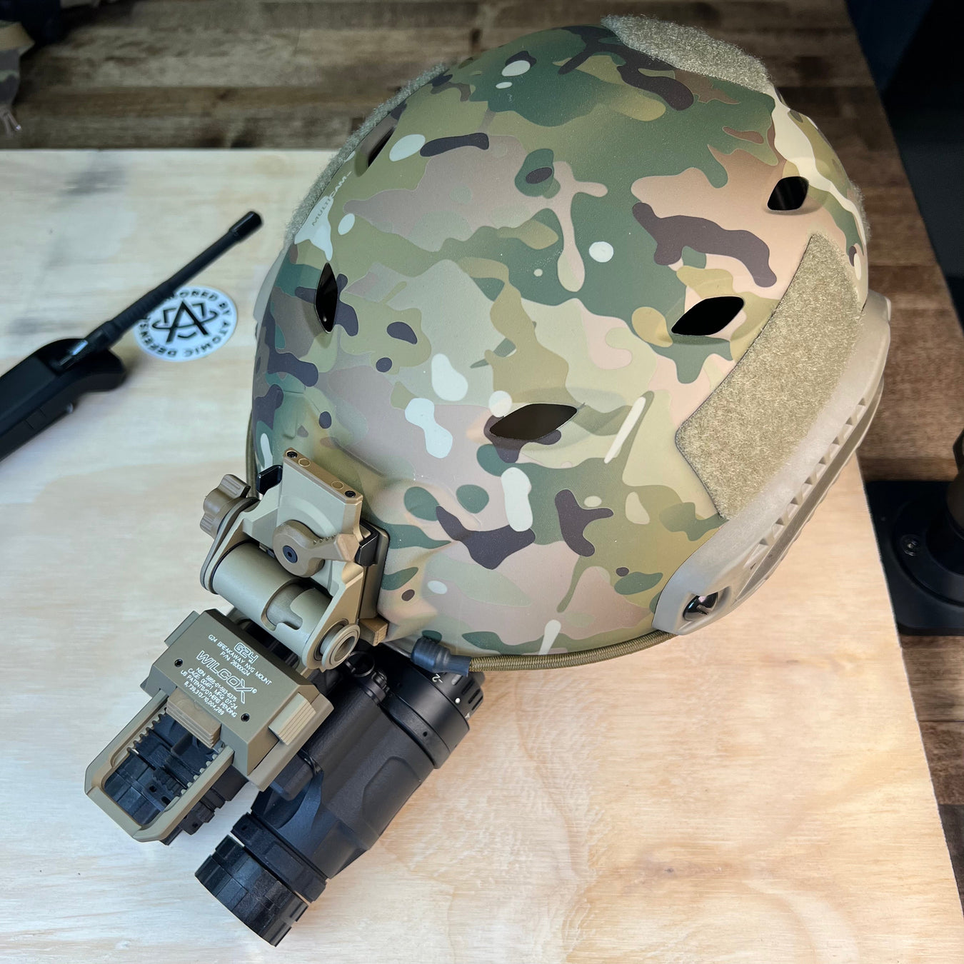 a profile view of the katana nvg mounted on a team wendy bump helmet with a wilcox g24