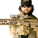 the image shocases a close up view of the DOT delta optic riser mount in the color fde or flat dark earth and is being mounted on top of a waepon with what looks to be a holographic sight also mounted on top of the mount itself, and the whole item is being held forward by someone who is wearing a camo outfit. 