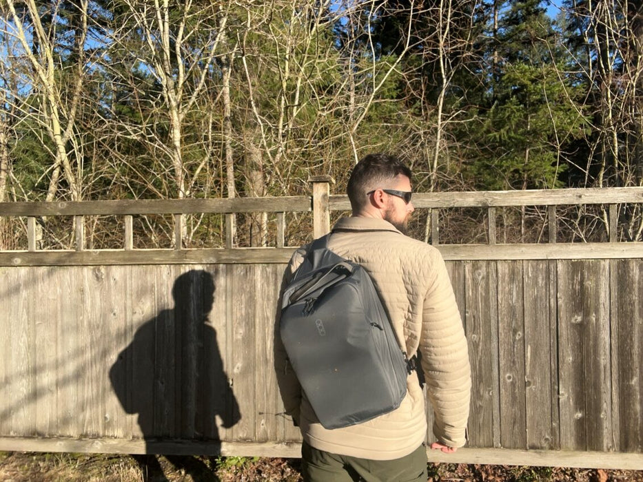 Back side view of the Eberlestock Fade Sling XL in black mounted to a Guy's Back.