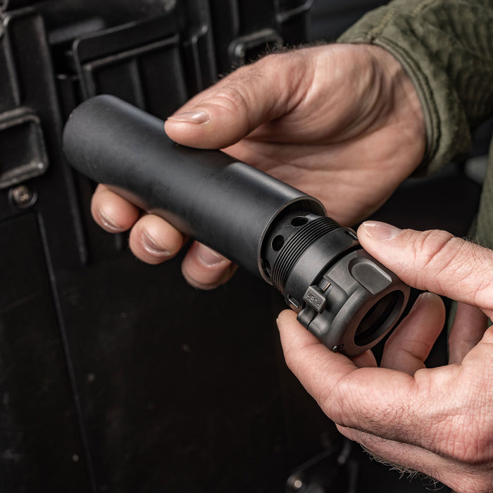 lifestyle image of the surefire fast attach hub being attached to a SOCOM556-RC3