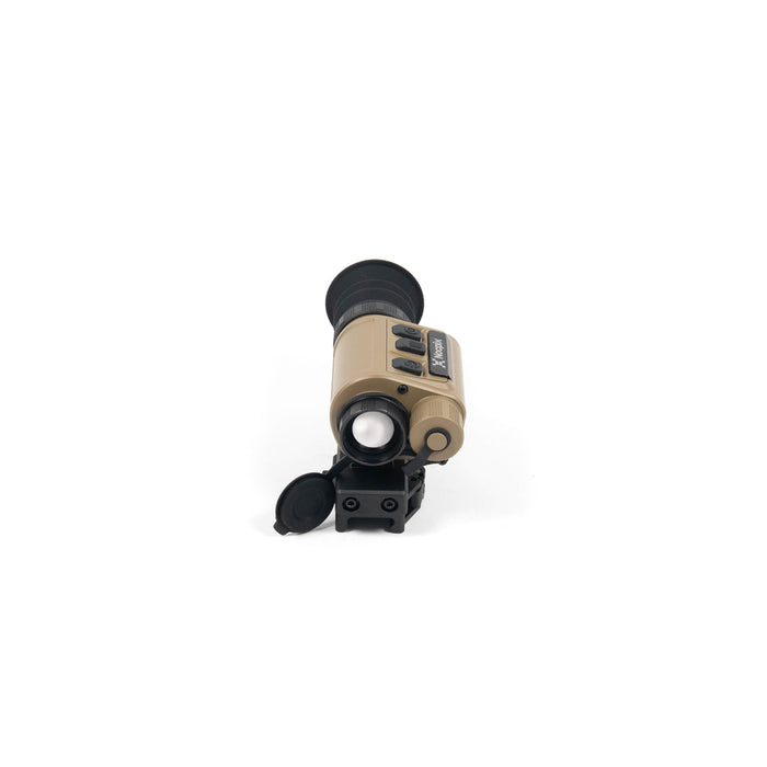 A direct frontal view of the Nocpix Micro 2 H25 Multifunction 640x512 Thermal Clip-On, focusing on the open objective lens aperture in the foreground, with the tan housing, black top control buttons, and rubber eyecup stretching into the background.
