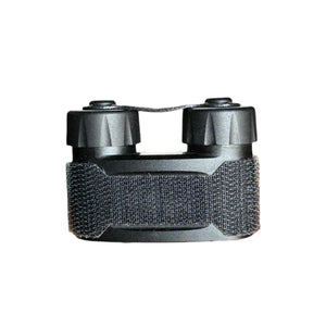 a product image of the nocturn industries the mini bat pack in the color black and you can see the velcro strapping in the middle of the battery pack as well as two cylinder-looking cases that two AA or CR123A Batteries may fit into.