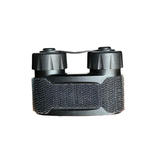 a product image of the nocturn industries the mini bat pack in the color black and you can see the velcro strapping in the middle of the battery pack as well as two cylinder-looking cases that two AA or CR123A Batteries may fit into.