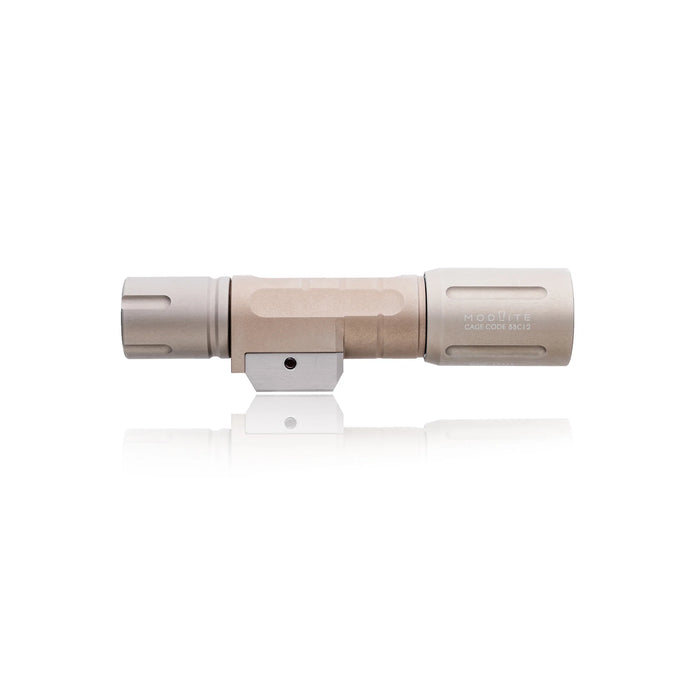 an image of the modlite pdw650 light in the color FDE where the image is situated in the middle of the photo against a white background, and is positioned horizontally as if it is sitting on its side, and the image is clear enough to see the texture and the hexagon design of the item.