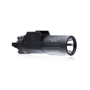 an image of the PL350 in the color black and has the PLHv3 light head where it is angled that you can see the right side of the item where the brand name and the words "dual fuel" is branded on it in white and we can see the attachment partition that attaches this light on a pistol.
