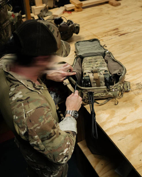 Operator ensuring his ROMAD Multicam is ready on Fort Riley.