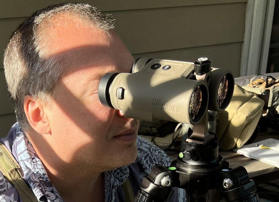 A man looking through the Sig Kilo 10k