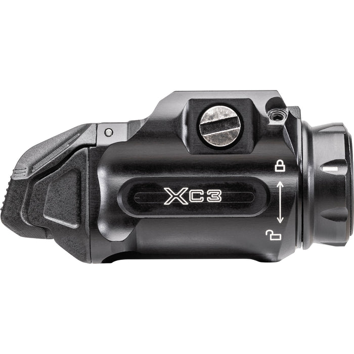 The Surefiew XC3-B on it's left isde view where you can see the mounting screw that is used to lock the weapon light on a pistol and the product name and locking instructions that are branded on the side.