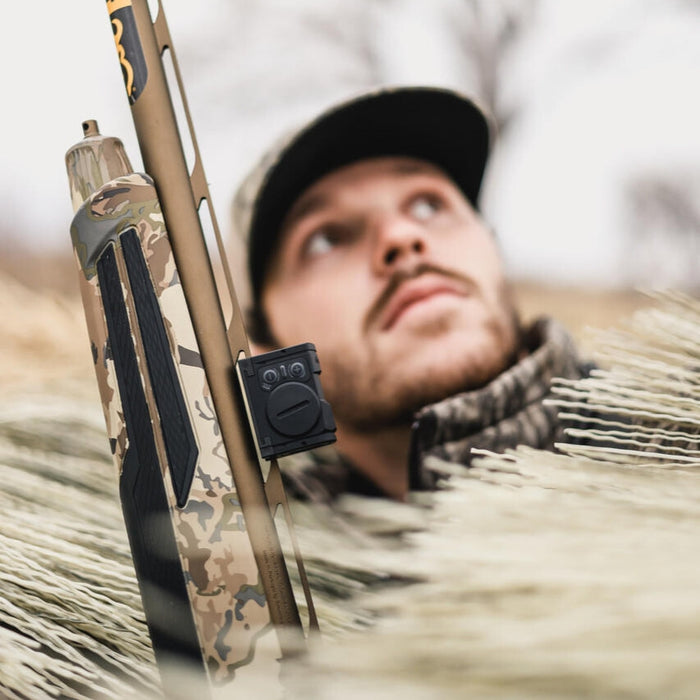 male shooter using the aimpoint acro s 2 on a hunting shotgun