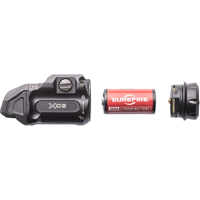 the surefire xc3-b pistol watch where the light head and body is detached to show the rechargable battery CR123A that is inside the pistol light