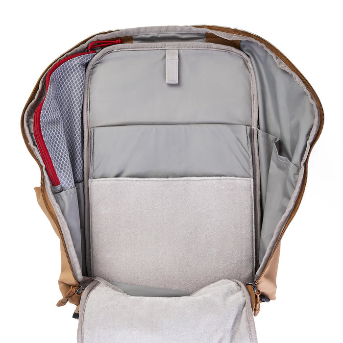 A close-up of the Vertx Siege 25L interior reveals a loop-lined laptop sleeve and organized tech compartments for secure storage of electronics and mission essentials.