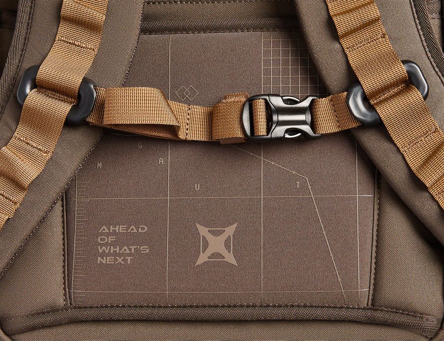 A close-up view of the bottom rear section of the Gamut 26, featuring the company logo and motto, with the adjustable sternum strap visible in the foreground.