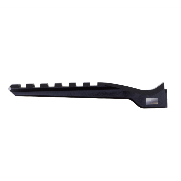 A detailed view of a black red dot riser with forward rail, showing its machined aluminum finish and mounting points for tactical accessories.