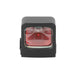A direct frontal view of the Holosun HS507K X2 optic, looking straight through the clear glass lens to show the bright red dot illuminated inside the rugged black housing.