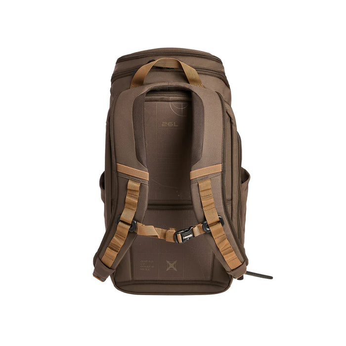 A frontal rear view of the Cedar Brown Vertx Gamut 26L, highlighting the padded shoulder straps and adjustable sternum strap in the foreground.