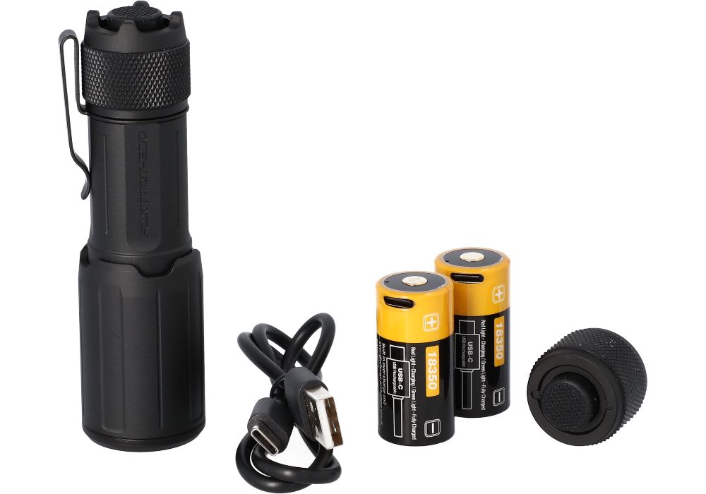A full layout of the included accessories for the Sig Foxtrot EDC Compact is displayed from left to right, showing the main flashlight body, a USB-C charging cable, two rechargeable batteries, and an interchangeable tailcap.