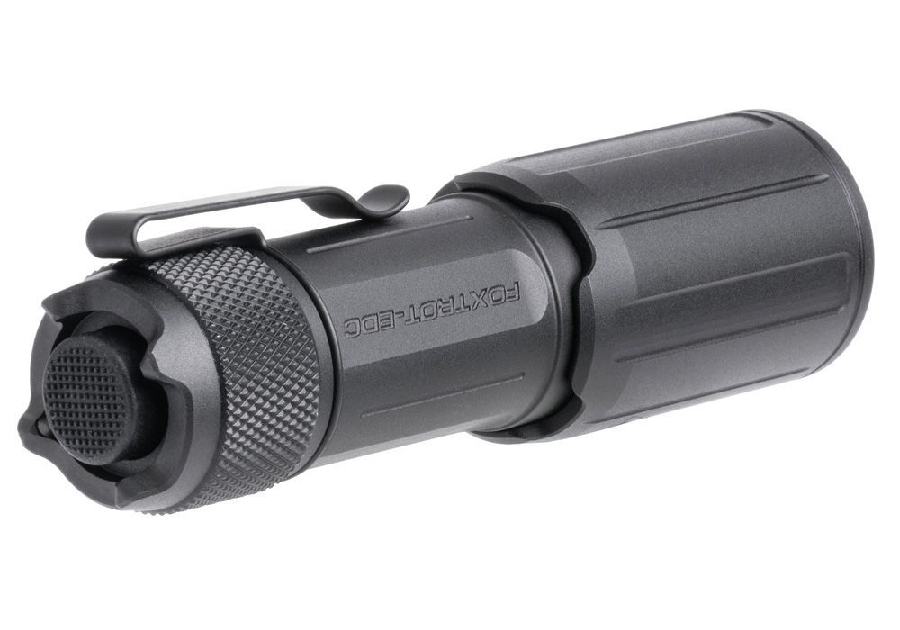 A high-resolution photo shows the left and rear angles of the Sig Sauer Foxtrot-EDC Compact, highlighting the sturdy metal pocket clip on the side and the tactical push-button switch on the back.