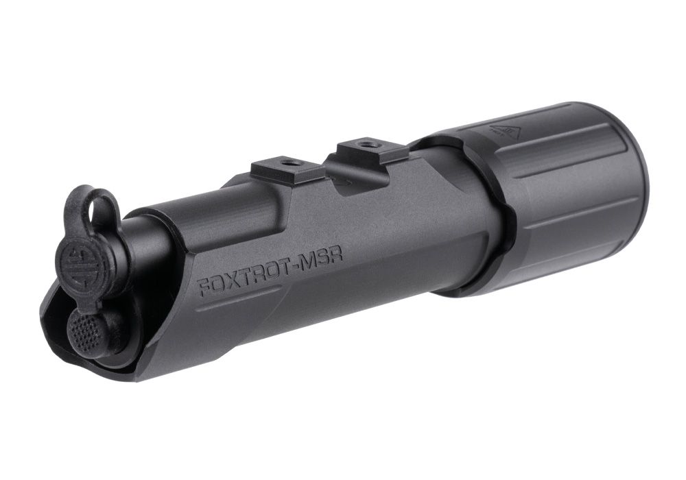 A rear angled view of the foxtrot msr full size weapon light, featuring the integrated push-button activation and remote tape switch plug interface in the foreground.