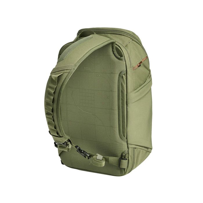 A rear angled view of the Vertx Gamut 18L Sling Bag, focusing on the padded shoulder strap and stretch water bottle pocket located in the foreground for easy hydration access .