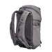 A rear-angled view of the Vertx Siege 25L tactical backpack features shoulder straps with easy-access compartments in the foreground and a breathable mesh back panel for airflow