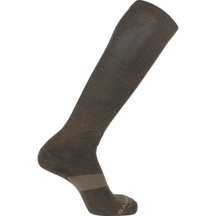 A side profile shot of the coyote brown Quest Forces Knee Tactical Socks laid flat, highlighting the anatomical shape and reinforced shin guard.