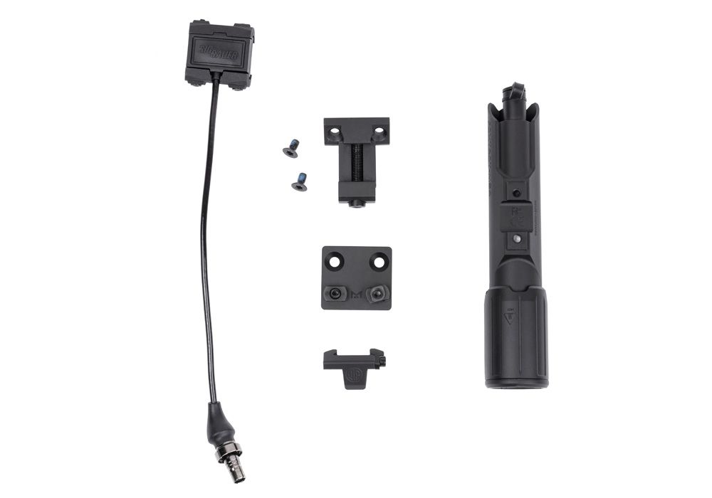 A top view of the foxtrot-msr full size light arranged with its full package contents, demonstrating all the necessary items required to install it on any rifle.