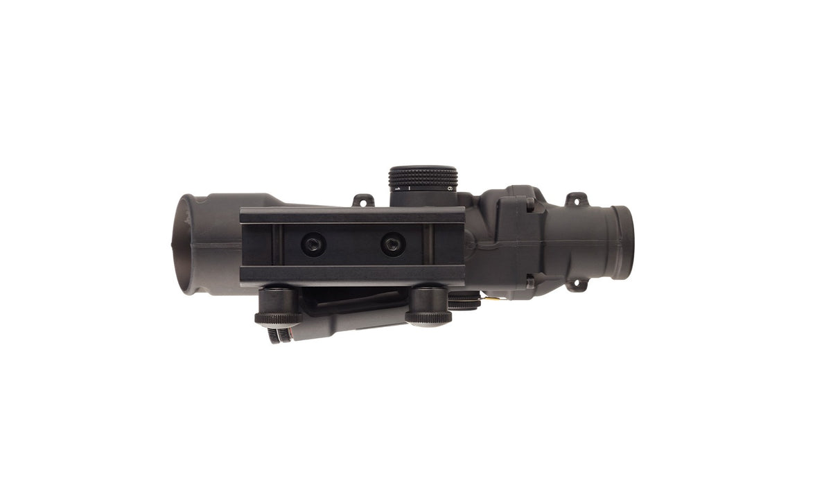 A bottom view of the acog 3.5x35 led scope showing the integrated mounting interface and the durable forged aluminum base that provides a rock-solid connection to the rifle rail.