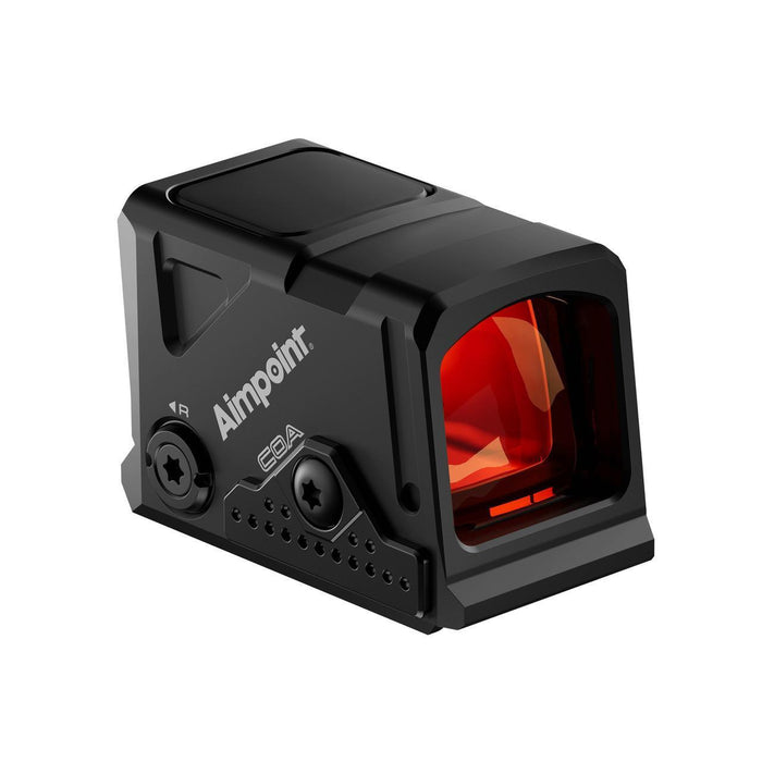 Front-left angled view of the Aimpoint COA enclosed red dot sight, highlighting the large red-tinted viewing window and compact optic housing.