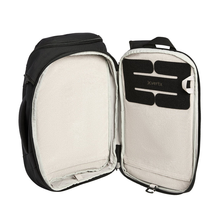 An open view of the Gamut CCW 18L Sling weapon compartment, displaying the internal BAP strap and velcro loop lining designed to securely mount holsters for various handguns.