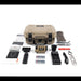An overhead view displaying the complete unboxed retail package for the Nocpix Micro 2 Thermal, showing the main optic, a tan hard carrying case, a dual battery charger, two batteries, a black mounting bracket, a remote control, a lens cloth, and the user manuals spread out on a white surface.