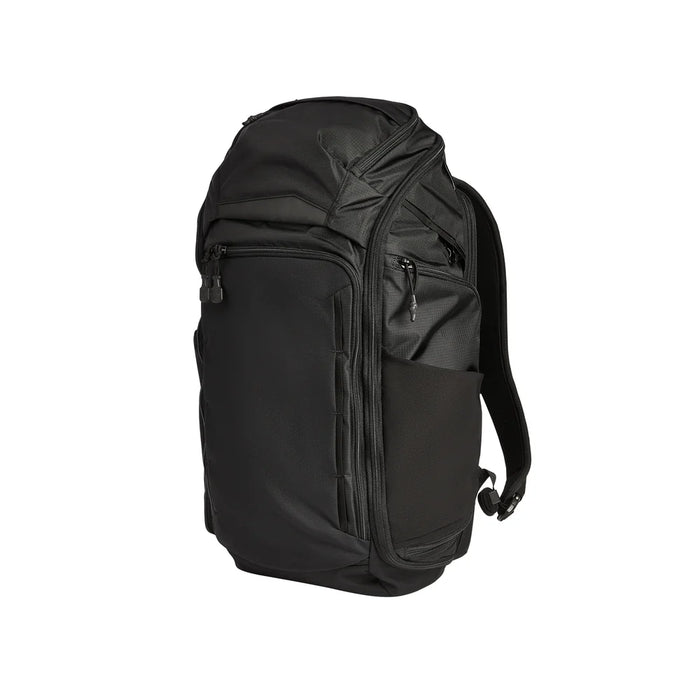 Angled side view of the black Vertx Gamut 32L backpack showing its side stretch pockets and streamlined profile.
