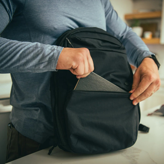A front-facing close-up of the admin pouch on the black Any Day EDC Backpack, showcasing its robust internal organization with translucent mesh pockets and a key lanyard loop designed for efficient small-item storage and quick access.