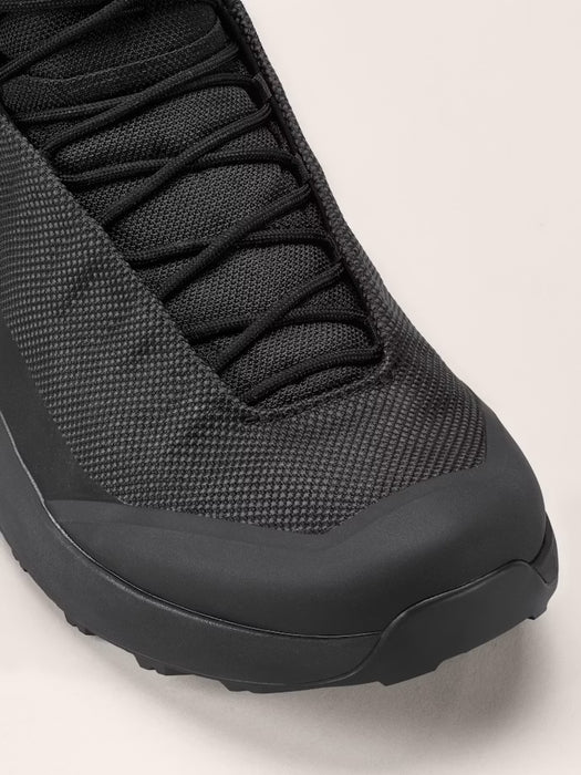 the arc'teryx kpoec mid gtx in the black variant zoomed in on the front tip of the shoe that is sealed and protected from water submersion.