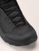 the arc'teryx kpoec mid gtx in the black variant zoomed in on the front tip of the shoe that is sealed and protected from water submersion.