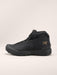 the arc'teryx kopec mid gtx in the color black showing it's textured side and the brand logo imprinted on it