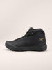 the arc'teryx kopec mid gtx in the color black showing it's textured side and the brand logo imprinted on it