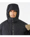 Close-up view of the adjustable hood on the black Arcteryx jacket, featuring high-performance Coreloft synthetic insulation designed to trap heat around the face and neck during sub-zero operations.