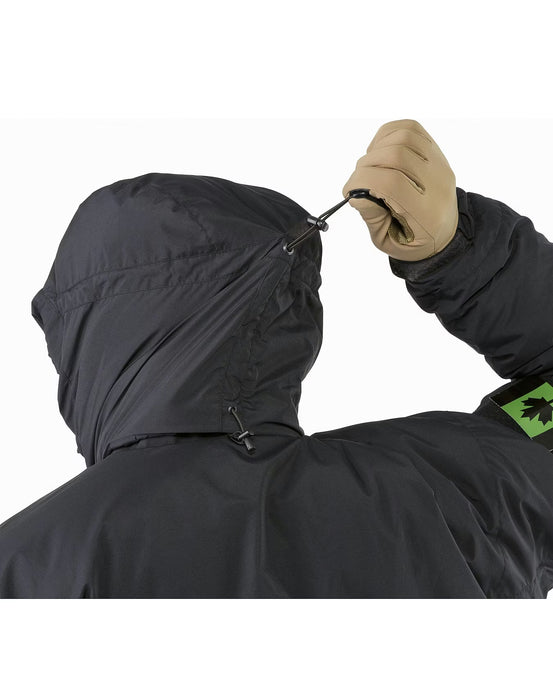 Back view of the black WX Jacket SV showing a person using the rear drawcord to adjust the insulated hood for a perfect fit during cold weather operations.