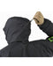 Back view of the black WX Jacket SV showing a person using the rear drawcord to adjust the insulated hood for a perfect fit during cold weather operations.