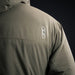Back right view of the Eberlestock Alturas Hooded Jacket with the logo in the foreground.