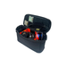A small, black rectangular storage case opened to reveal an orange padded interior safely holding dual-tube night vision goggles and identification markers, showcasing essential pieces of high-end men's tactical gear.