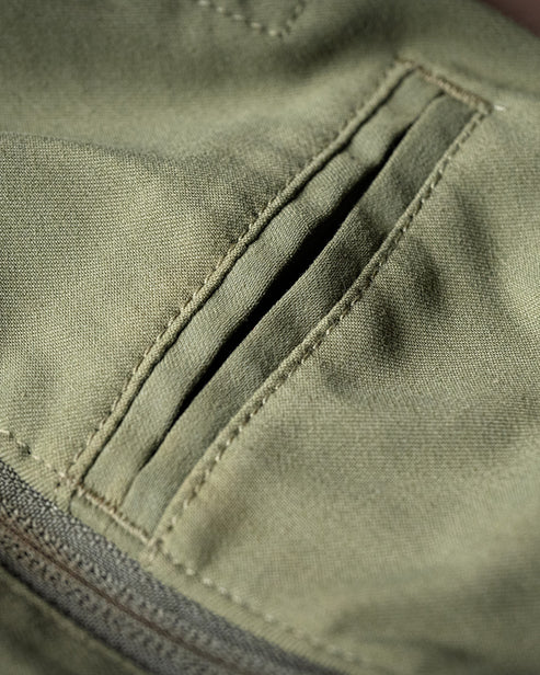 Zoomed-in shot of the phone pocket on the Fall Green Camas Professional Trousers.