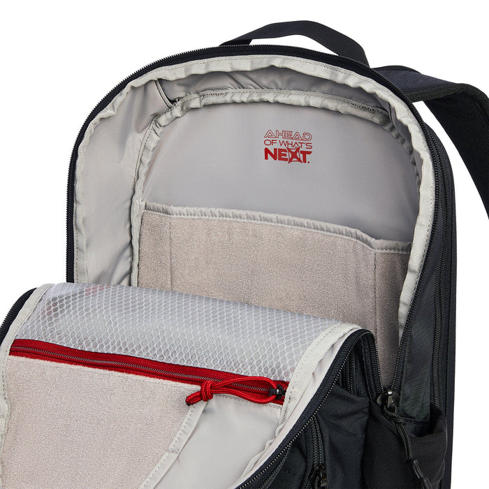 A detailed close-up shot of the loop-lined tech sleeve within the main compartment of the Ready Pack X 20L , showing how the padded material protects a 15-inch laptop and utilizes a light-colored interior lining  to help you find your electronics quickly in low-light environments.