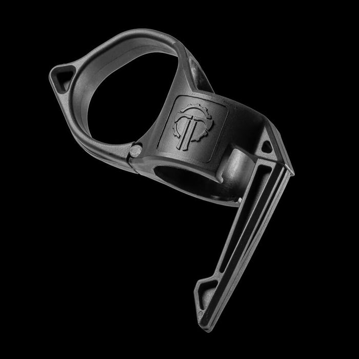 close up of a black switchback ring against a black background