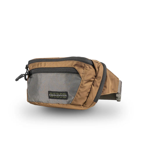 A right-side angled view of the Coyote Brown Eberlestock Bando Bag for sale, highlighting the earth-tone color that blends perfectly into outdoor environments.