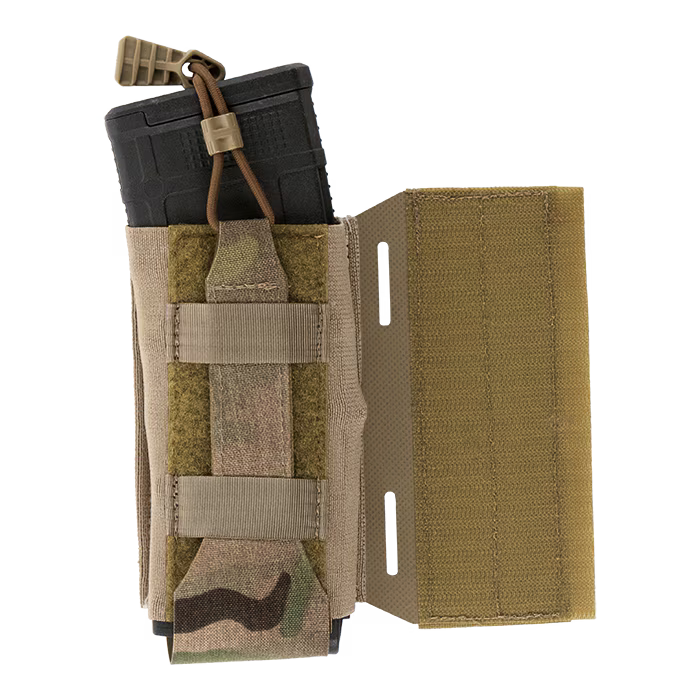 A close-up detail of the MultiCam Crye Precision LPV Side Radio Pouch carrying a black M4 magazine, highlighting the removable, adjustable shock cord with a tan pull tab that provides secure, customizable gear retention.